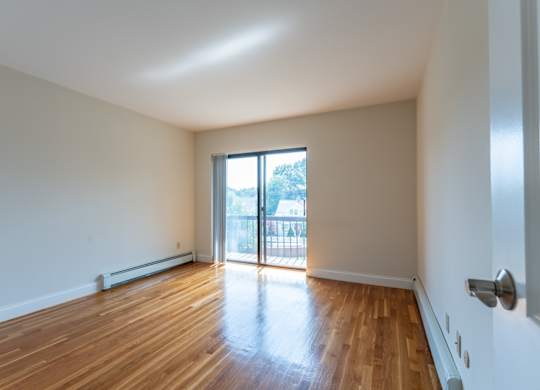hardwood flooring and balcony slider door