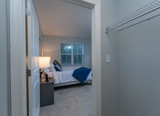 Two bedroom model apartment bedroom with plush carpeting