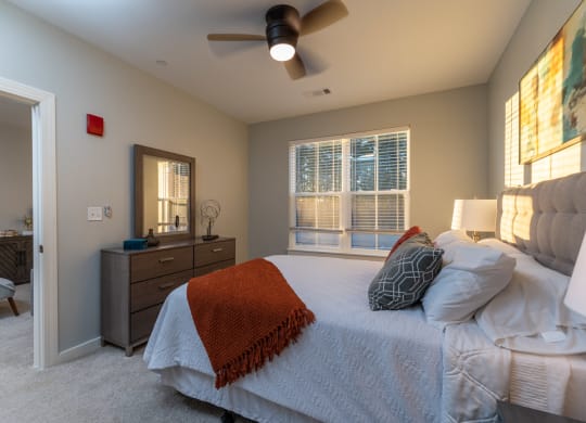 redbrook modle apartment bedroom with ceiling fan and large windows