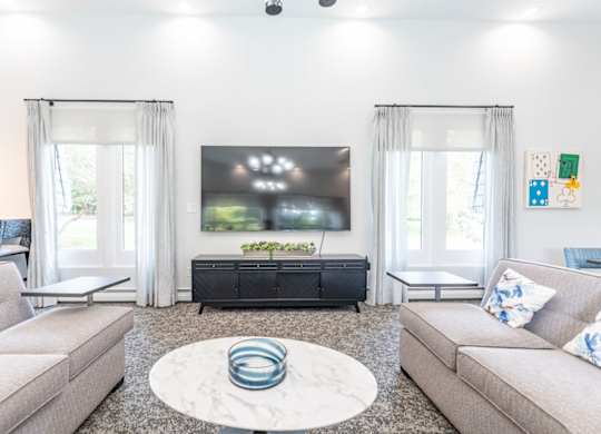 a living room with a couch and a table and a television