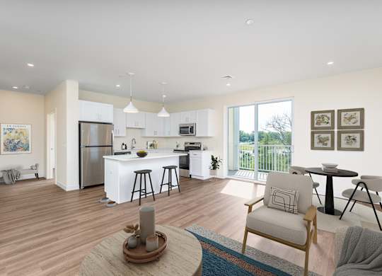 Fully staged great room—kitchen with island seating, dining set and lounge furniture—flowing to a balcony through glass doors.