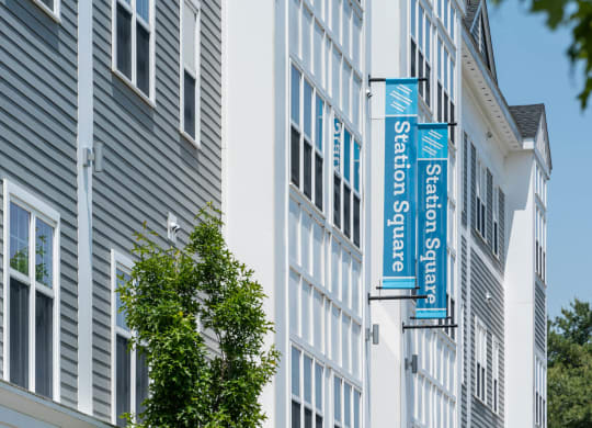 a picture of a building with a blue and white sign on the side of it