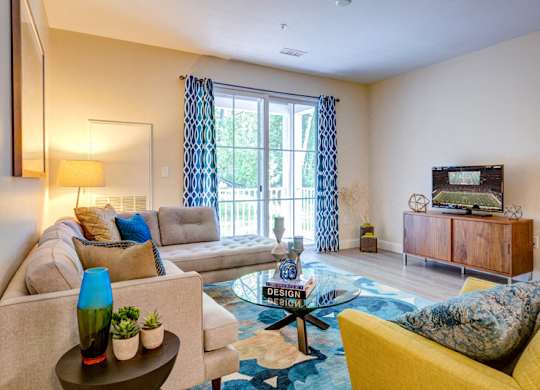 Model apartment living room family room with balcony and furnishings