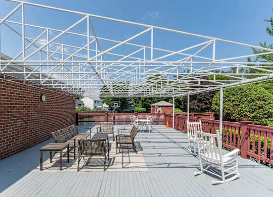 awning over a patio with chairs and tables