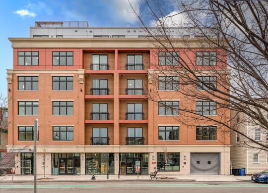 a large brick building with a parking garage in front of it at Union 346, Somerville, MA