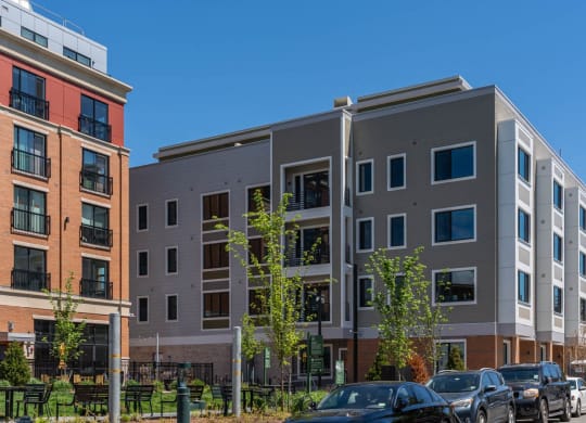 a new apartment building with cars parked in front of it  at Union 346, Somerville, MA 02143
