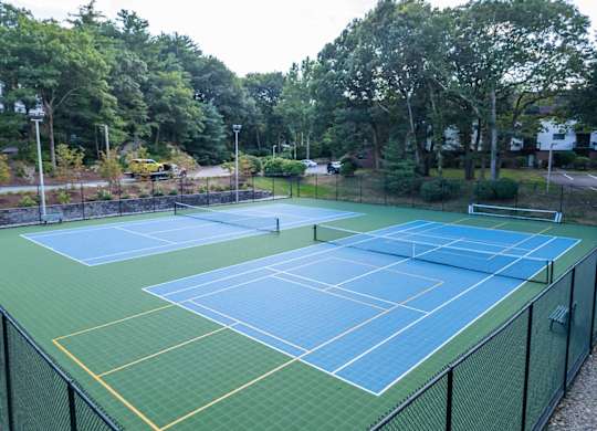 a couple of tennis courts striped for pickleball