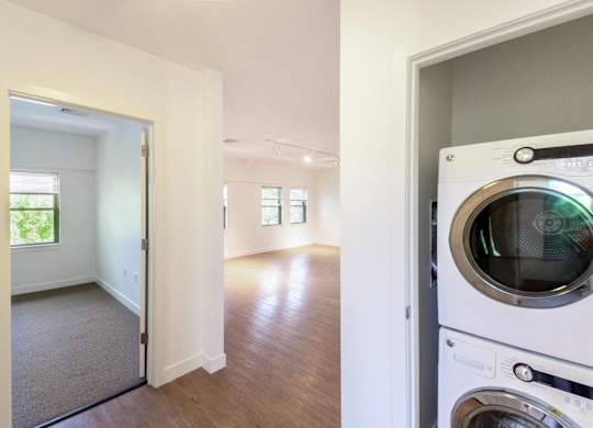 a laundry room with a washer and a dryer in a houseat Ames Shovel Works Apartments, North Easton, MA, Massachusetts