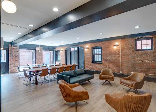 Community room with table and chairs at Ninth Square Apartments. at Ninth Square Apartments, New Haven