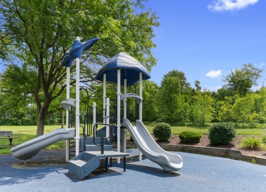 A playground with slides in a park at Huntingdon Village Hunker, PA.