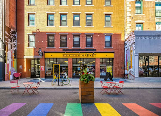 a crosswalk in front of a store on a city street at Ninth Square Apartments, New Haven, CT