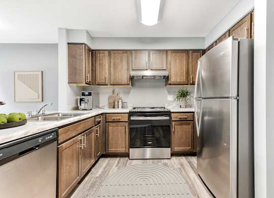 Kitchen With Wooden Cabinets And Stainless Steel Appliances at Niagara Square, New York, 14201