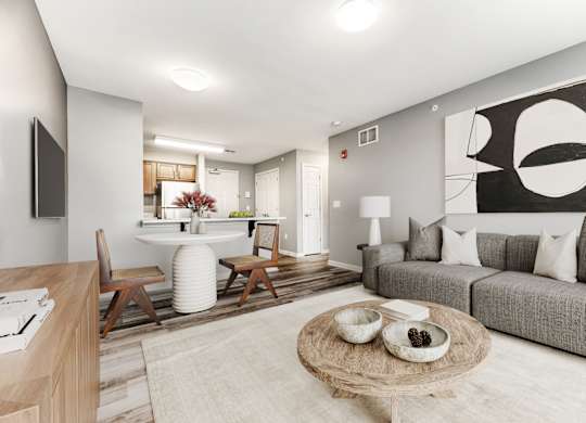 Living And Dining Area With Gray Couch And Ottoman at Niagara Square, Buffalo, 14201