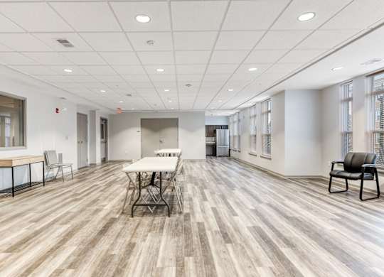 Resident Community Room With Seating and Kitchen at Niagara Square, Buffalo, 14201