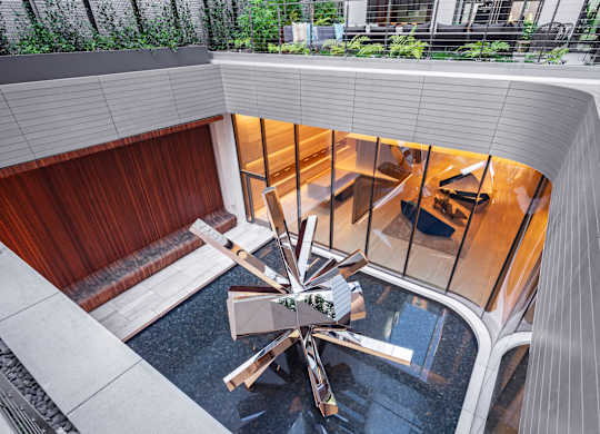 A modern building with a spiral staircase in the center.