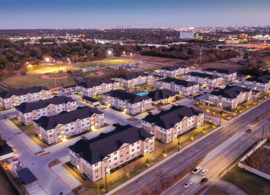 an aerial view of a neighborhood at night at 55 Fifty at Northwest Crossing, Texas, 77092