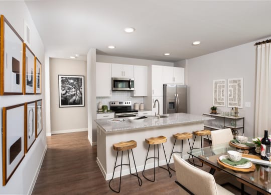 a kitchen and dining area at 55 Fifty at Northwest Crossing, Texas, 77092