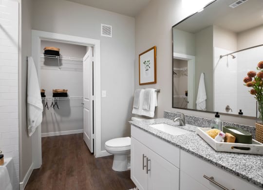 our apartments offer a bathroom with a shower at 55 Fifty at Northwest Crossing, Houston