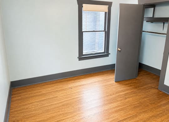 4729Roosevelt Bedroom2 with closet and a wooden floor.