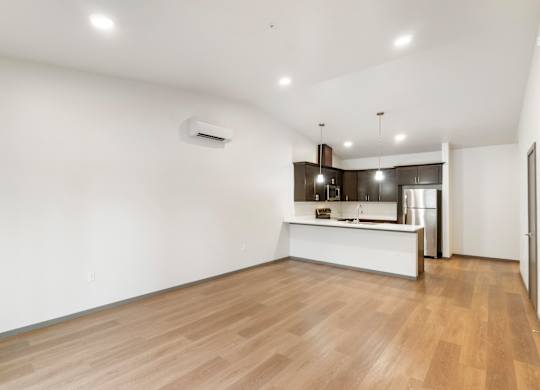 A room with wooden floors and white walls.