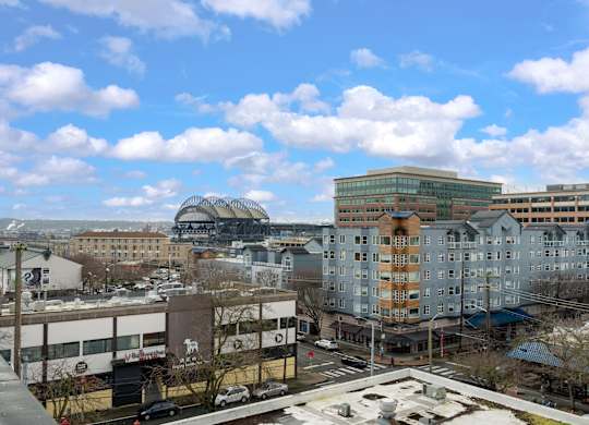 A cityscape with buildings and a clear sky.