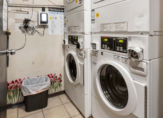 A row of washing machines in a laundromat.