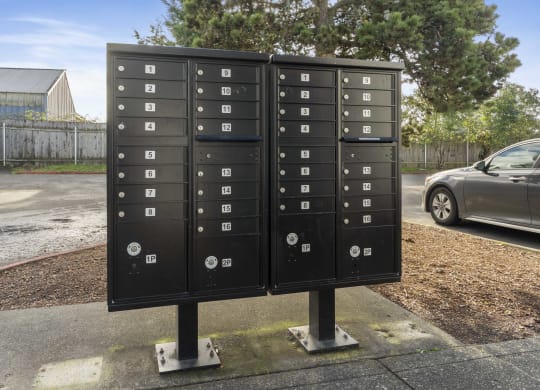 a row of mailboxes on the side of a street