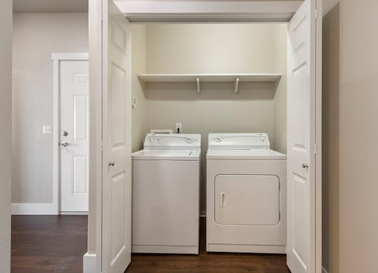 Laundry closet with washer and dryer