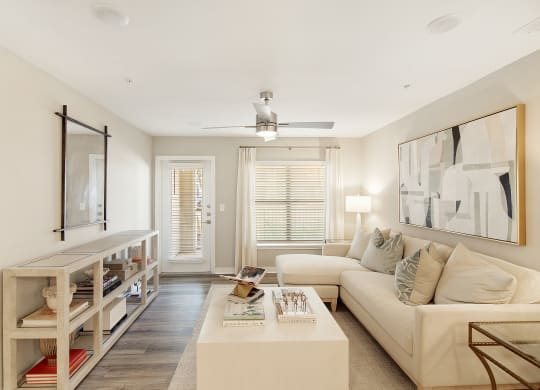 a living room with a couch and a coffee table at The Azul Apartment Homes in Oxford, MS 38655