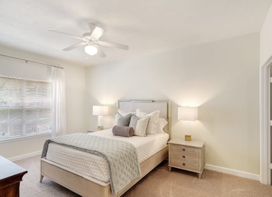 a bedroom with a bed and a ceiling fan at Summit of Shreveport Apartments, Shreveport, LA, 71105