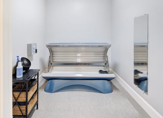 a patient room with a hospital bed and a mirror at Summit of Shreveport Apartments, Shreveport, Louisiana
