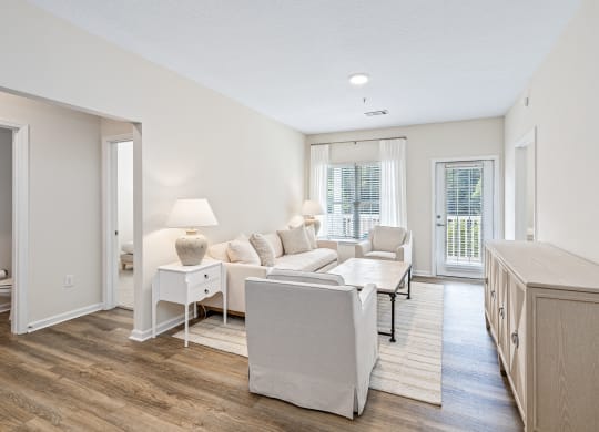 a living room with a couch and a table at The Met Apartment Homes, Mississippi