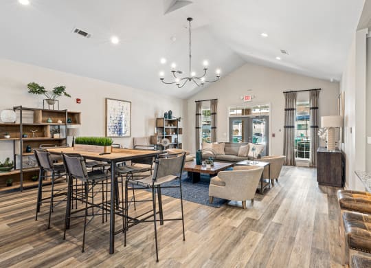 the reserve at city center spacious living room with dining table and chairs at The Met Apartment Homes, Mississippi 39402