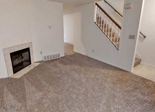 Spacious Living Room with Fireplace at Arbor Pointe Townhomes in Battle Creek, MI