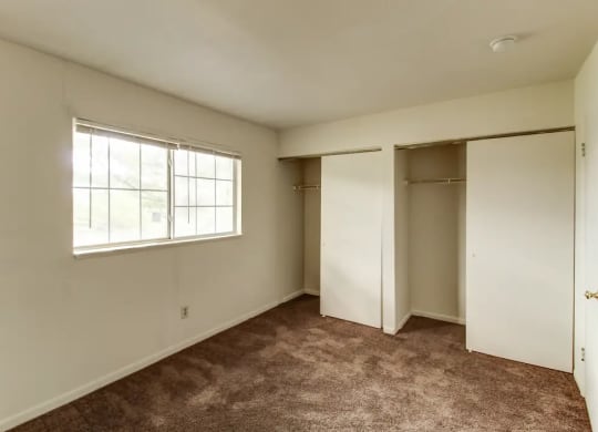 Vacant Bedroom with large closets at Arbor Pointe Townhomes, Battle Creek, Michigan