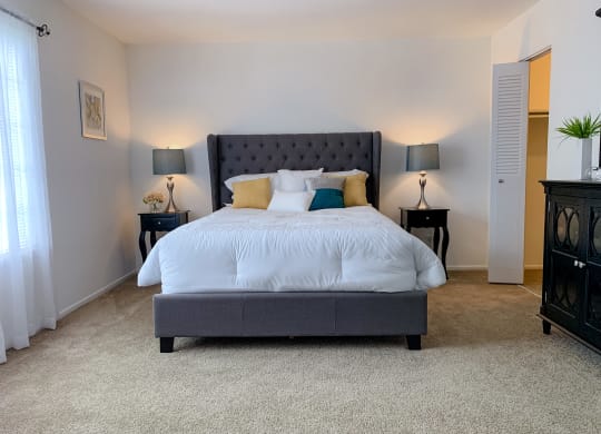 Spacious modern bedroom with walk-in closet at The Lodge Apartments in Indianapolis, IN