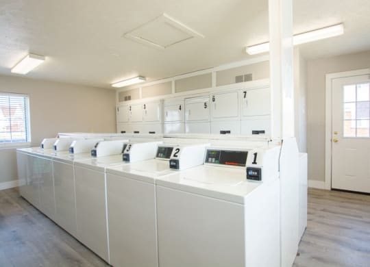Bright Laundry Room at Waterstone Place Apartments, Indiana