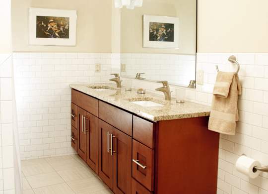 a bathroom with a sink and a toilet at 100 South Apartments, Buffalo, NY