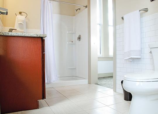 a bathroom with a toilet at 100 South Apartments, New York, 14202