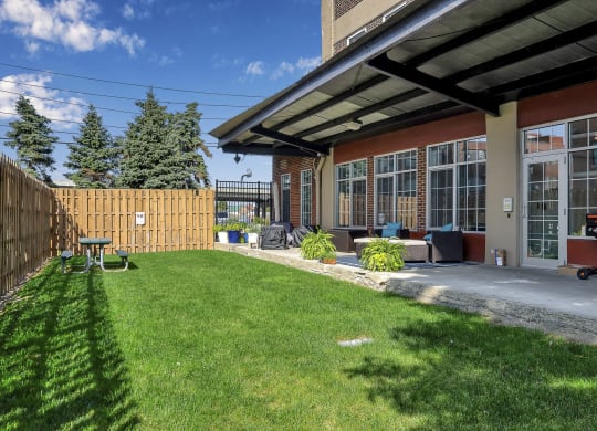 a backyard with a patio and a fence at The Lofts at Elk Terminal, Buffalo, NY, New York