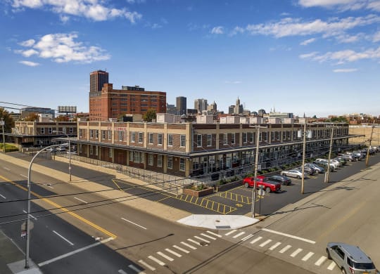an aerial view of a city street and a large building at The Lofts at Elk Terminal, Buffalo, NY, New York, 14204