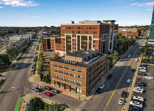 an aerial view of a building in a city at 100 South Apartments, New York, 14202