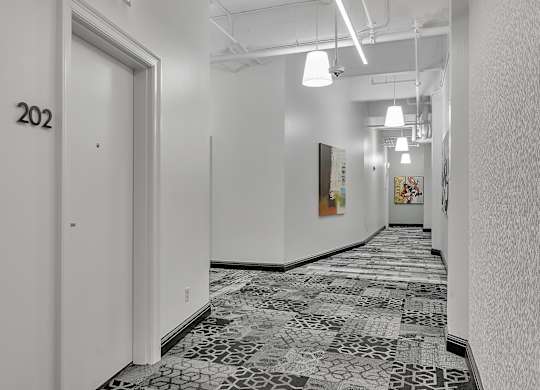 a view of a hallway with white walls and a tile floor at 100 South Apartments, New York