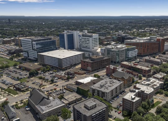 an aerial view of a city with tall buildings and cars at Nineteen North, Buffalo, NY, 14202