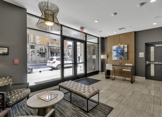 a lobby with a reception area and a street view at Nineteen North, Buffalo, 14202