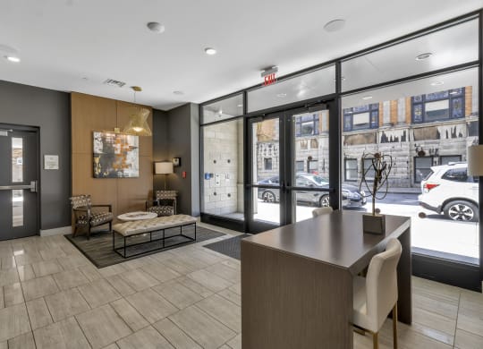 a lobby with a reception desk and a street view at Nineteen North, Buffalo, New York