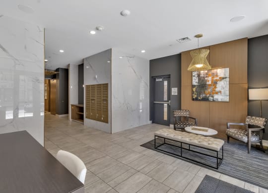 a lobby with a reception desk and chairs and a table at Nineteen North, New York