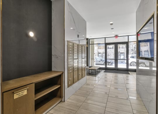 a hallway with a desk and a door to a building at Nineteen North, New York