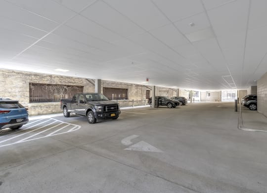 the parking garage at the upper levels of the building is filled with cars at Nineteen North, Buffalo, 14202