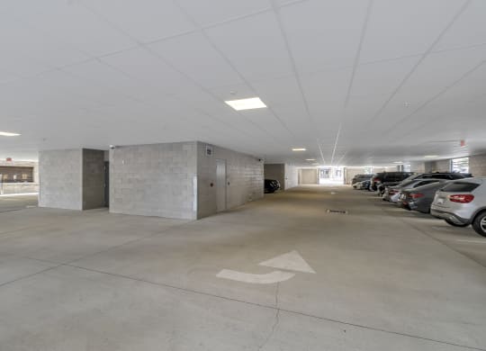 an empty parking garage with cars parked in it at Nineteen North, Buffalo, 14202